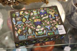 A Chinese white metal cigarette box with enamel decoration.