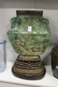 An unusual large Chinese carved jadeite vase on stand (converted to a lamp).