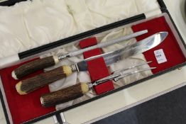 An antler handled carving set, cased.
