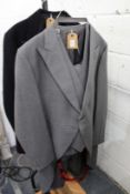 Moss Bros grey morning suit with top hat together with a dinner suit.