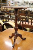 A mahogany tripod table.
