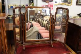 A folding dressing table mirror.