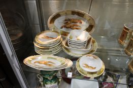 A continental porcelain part service decorated with lobsters.