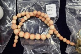 A stained ivory bead necklace.