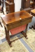 A 19th century rosewood work table with foldover rectangular top, single frieze drawer, a pull-out