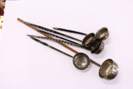 A collection of six silver and white metal toddy ladles.