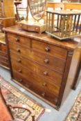 A 19th century mahogany chest of drawers with column supports.