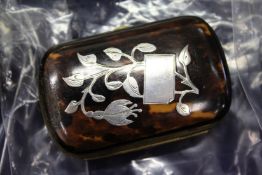 A tortoiseshell and silver inlaid small purse and similar trinket box.
