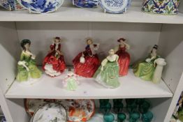 A collection of Royal Doulton figurines.