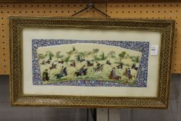 A Persian hand painted hunting scene on bone slither, framed and glazed.