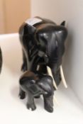 Two carved ebony elephants.