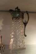 A good silver plated and cut glass claret jug.