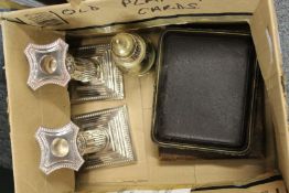 A pair of Corinthian column candlesticks and other items.