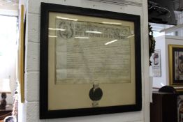 A large framed and glazed indenture with wax seal.