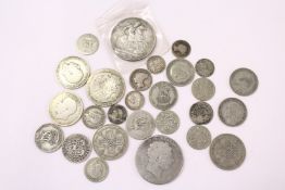A Victorian crown, various shillings and other coinage.