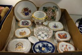 Reproduction armorial porcelain salts and other decorative china.