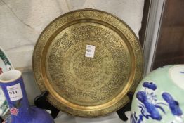 An eastern engraved brass circular tray.