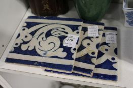 Three Islamic blue and white tiles.