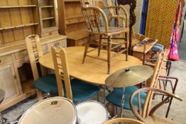 A stylish dining table and four chairs.
