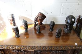 A collection of African and Polynesian carved hardwood busts.