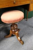 A 19th century mahogany revolving music seat.