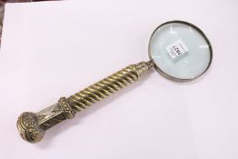 A large hand magnifying glass.
