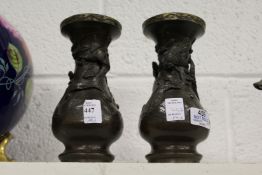 A pair of Japanese bronze vases.