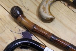 A Chinese carved bamboo walking stick.