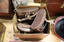 A group of four binoculars to include an early Carl Zeiss pair, all with leather cases.