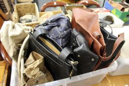 A large collection of ladies' handbags.
