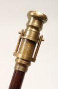A NOVELTY WALKING STICK, the handle as a telescope and compass. 39ins high.