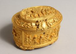 A FRENCH OVAL GILDED METAL JEWEL BOX AND COVER, the lid with figures outside an inn, figures