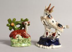 A SMALL STAFFORDSHIRE BOCAGE GROUP OF A DEER with spots and a GOAT with KID. 3.5ins & 5ins high. (