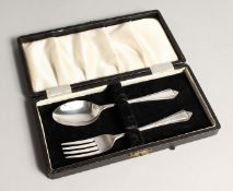 A CASED SILVER CHRISTENING SET,comprising of a spoon and fork. Sheffield 1964.