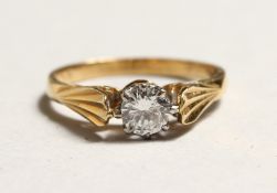 AN 18CT GOLD DIAMOND SOLITAIRE RING