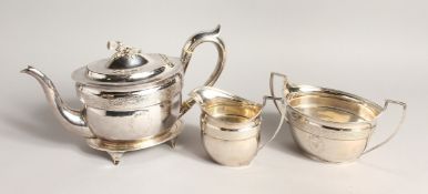 A GOOD SCOTTISH SILVER FOUR PIECE TEA SERVICE, comprising an oval tea pot with cast thistle