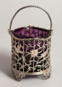 A SILVER SWING HANDLE CREAM PAIL, of open design with pierced and engraved decoration depicting