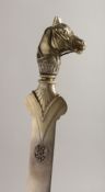 A SUPERB RUSSIAN SLIVER LETTER OPENER with initials and horse's head with sapphire eyes. Faberge