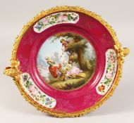 A 19TH CENTURY SEVRES PORCELAIN CIRCULAR DISH in an ornate mount painted with vignettes of flowers
