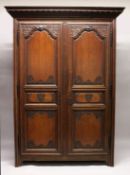 A GOOD LARGE 19TH CENTURY FRENCH OAK TWO DOOR ARMOIRE, with a dentil moulded cornice, a pair of