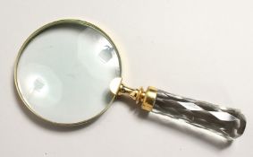 A MAGNIFYING GLASS with cut glass handle