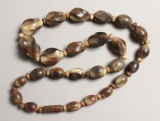 A STRING OF HORN BEADS