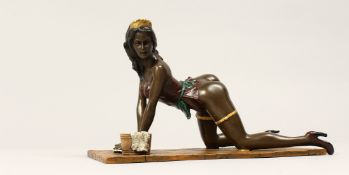 AN EROTIC BRONZE GROUP OF A SEMI NUDE WOMAN, cleaning a floor. 9ins long