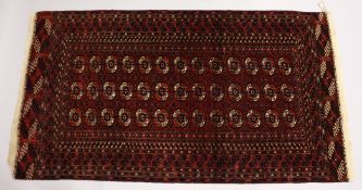 A TURKOMEN TEKKE CARPET, claret ground with three rows of thirteen gulls. 8ft x 4ft 5ins.