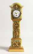 A SUPERB 19TH CENTURY ONYX MINIATURE LONGCASE CLOCK, the white dial with painted garlands, the