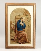 A 19TH CENTURY BRUSSELS NEEDLEWORK OF SAINT PETER seated in a chair, arms crossed. 25ins x 15ins.