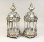 A PAIR OF CIRCULAR SHAPED SILVER METAL HANGING LANTERNS 24ins high.
