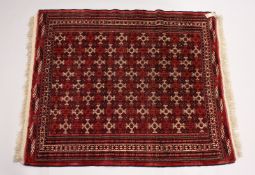 A TURKOMEN YAMUD CARPET, red ground with all over geometric design. 5ft 10ins x 4ft 8ins