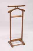 A HARDWOOD CLOTHES VALET 3f 5.5ins high.