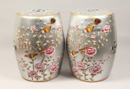 A PAIR OF CHINESE PORCELAIN BARREL SEATS, silvered ground decorated with birds and flowering